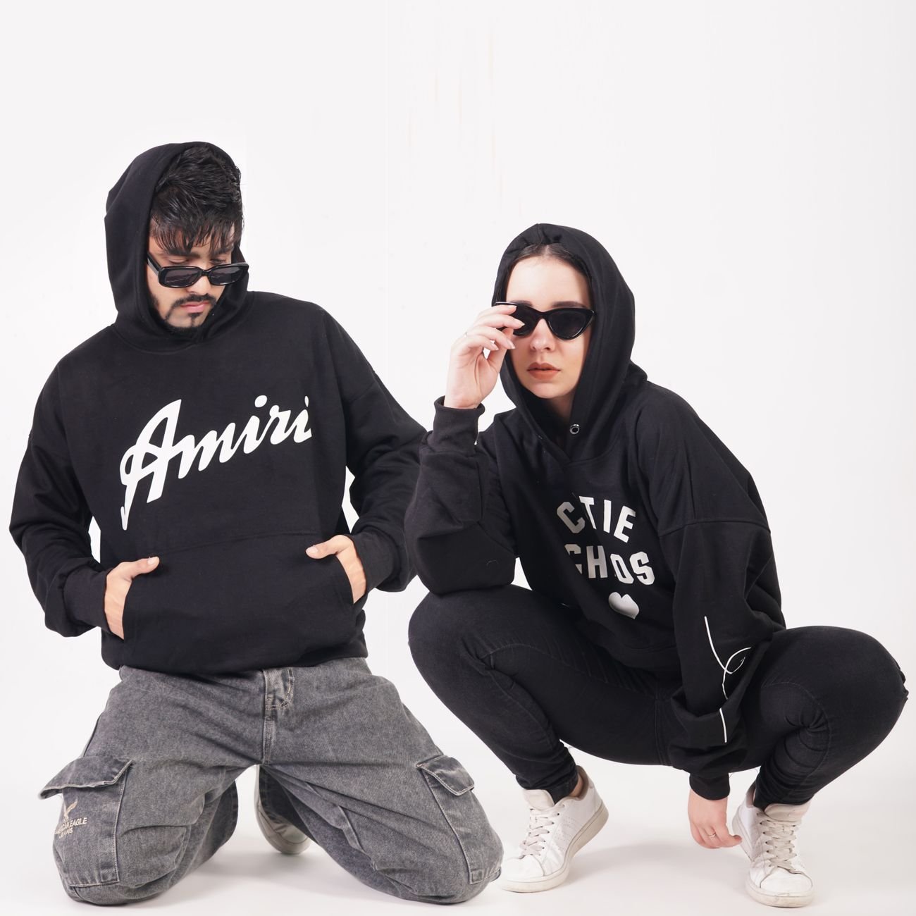 Stylish young adults in graphic hoodies and streetwear